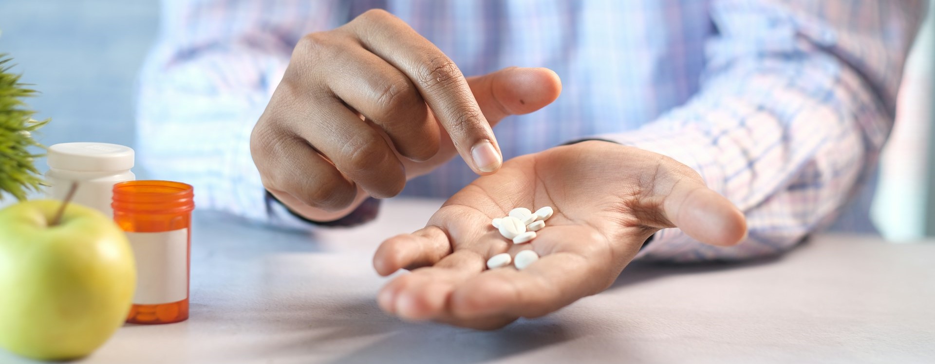 Man holding pills
